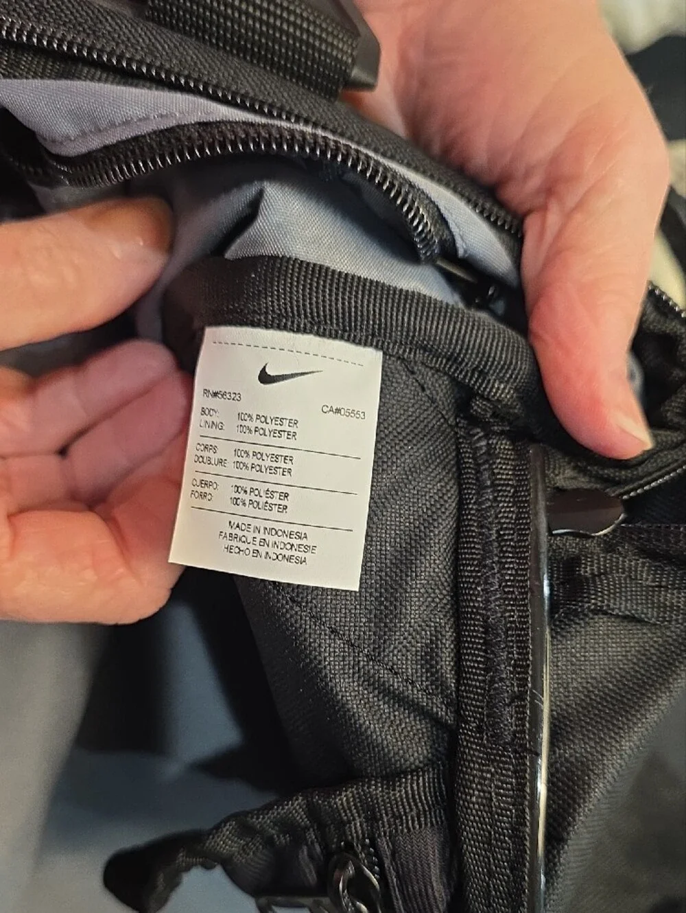 Nike Black Duffel Bag with White Swoosh and Branded Strap